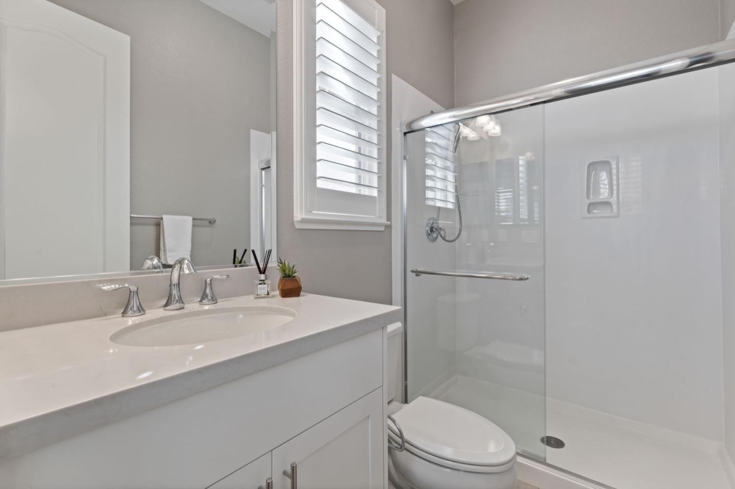 39941 Seal Drive Newark, CA 94560 - Photo 13 of 28 a bathroom with a sink toilet and shower