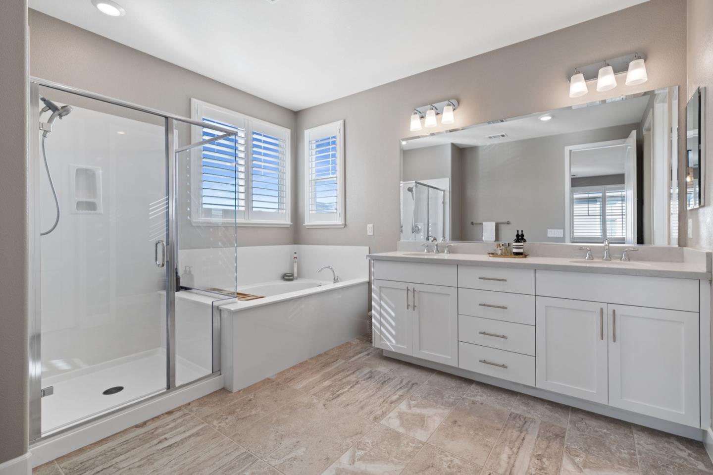 39941 Seal Drive Newark, CA 94560 - Photo 24 of 28 a spacious bathroom with a tub sink shower and mirror
