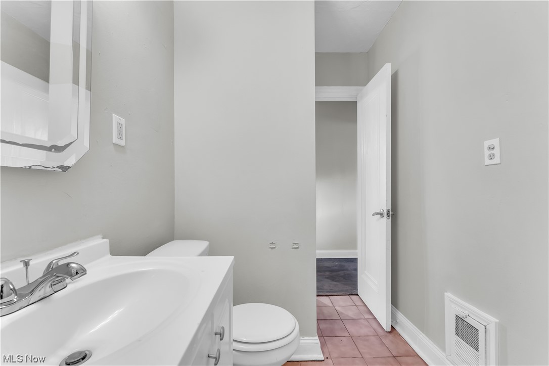 1499 Sherbrook Road South Euclid, OH 44121 - Photo 41 of 41 Bathroom with vanity, toilet, and tile flooring
