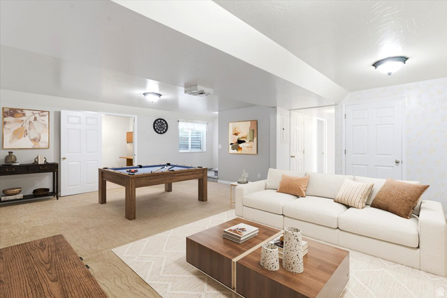 72 Canal Bank Road Garland, UT 84312 - Photo 22 of 40 Spacious lower-level area with recessed and flush-mount lighting, featuring a billiards table, multiple doorways, and a window with blinds