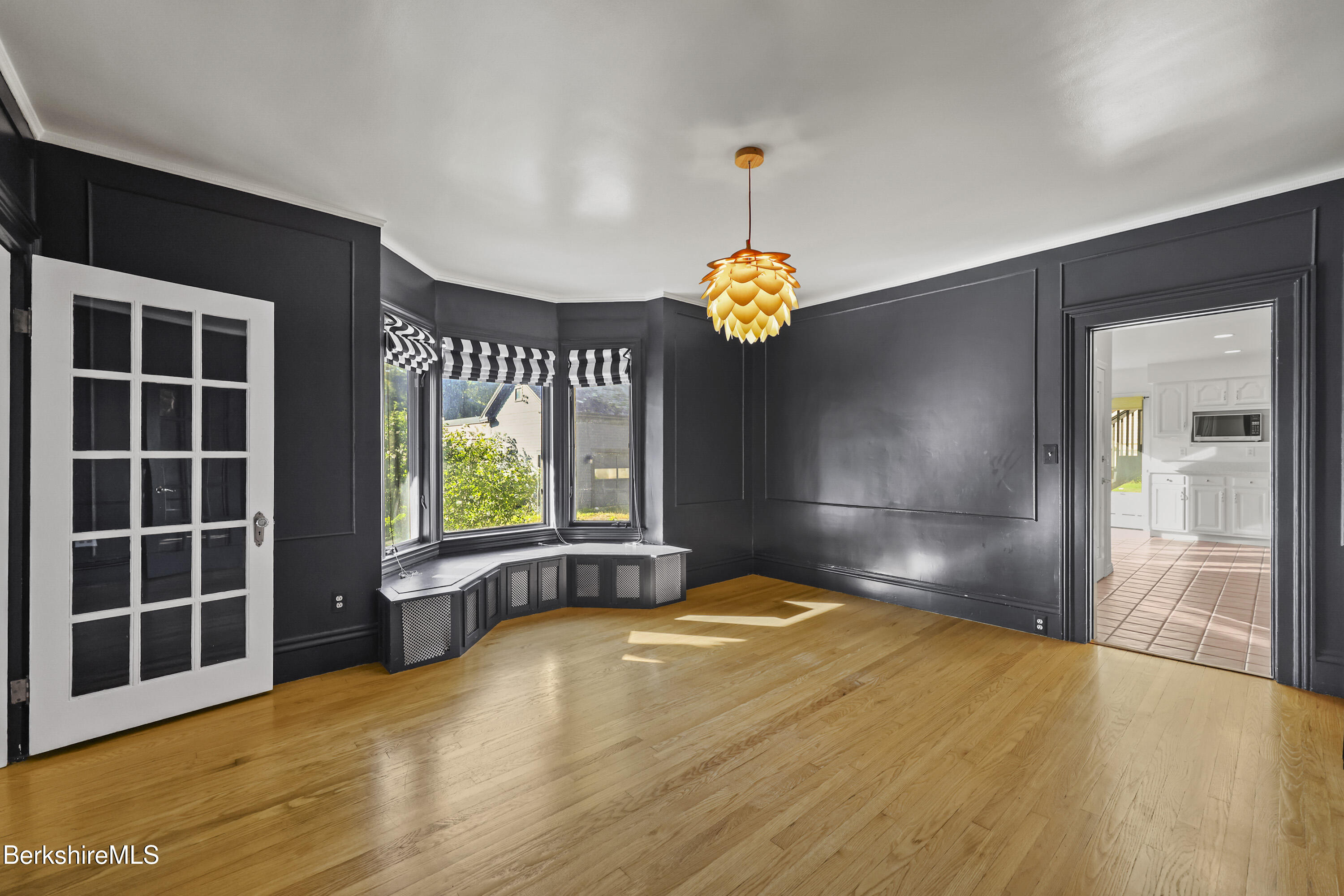 22 Maple Street Adams, MA 01220 - Photo 11 of 65 a view of an empty room with a window and wooden floor