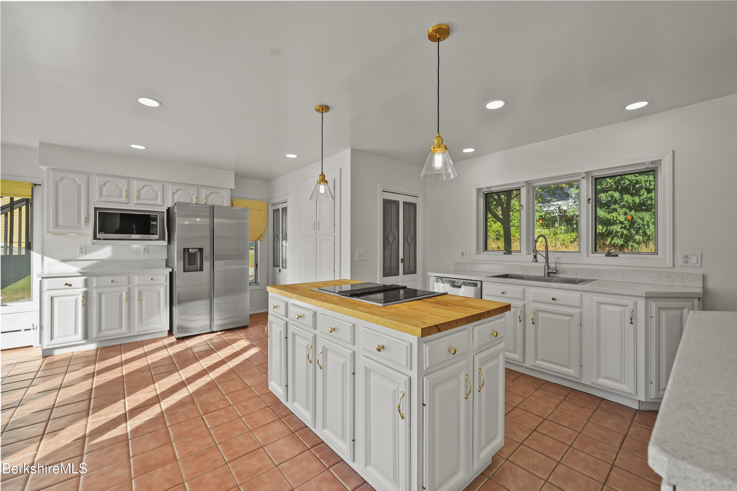 22 Maple Street Adams, MA 01220 - Photo 17 of 65 a kitchen with stainless steel appliances granite countertop a sink and a stove