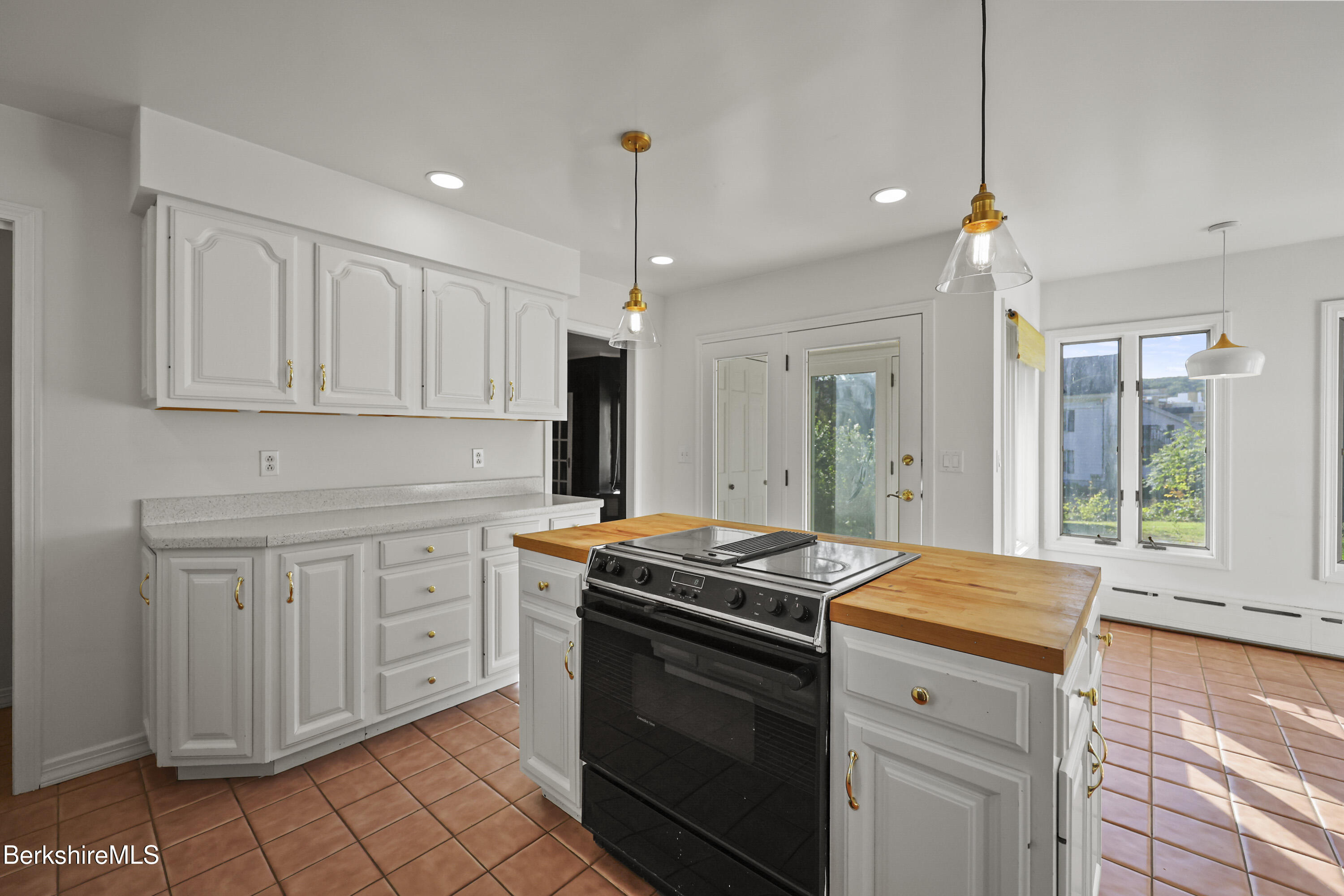 22 Maple Street Adams, MA 01220 - Photo 20 of 65 a kitchen with stainless steel appliances granite countertop a stove a sink and a refrigerator