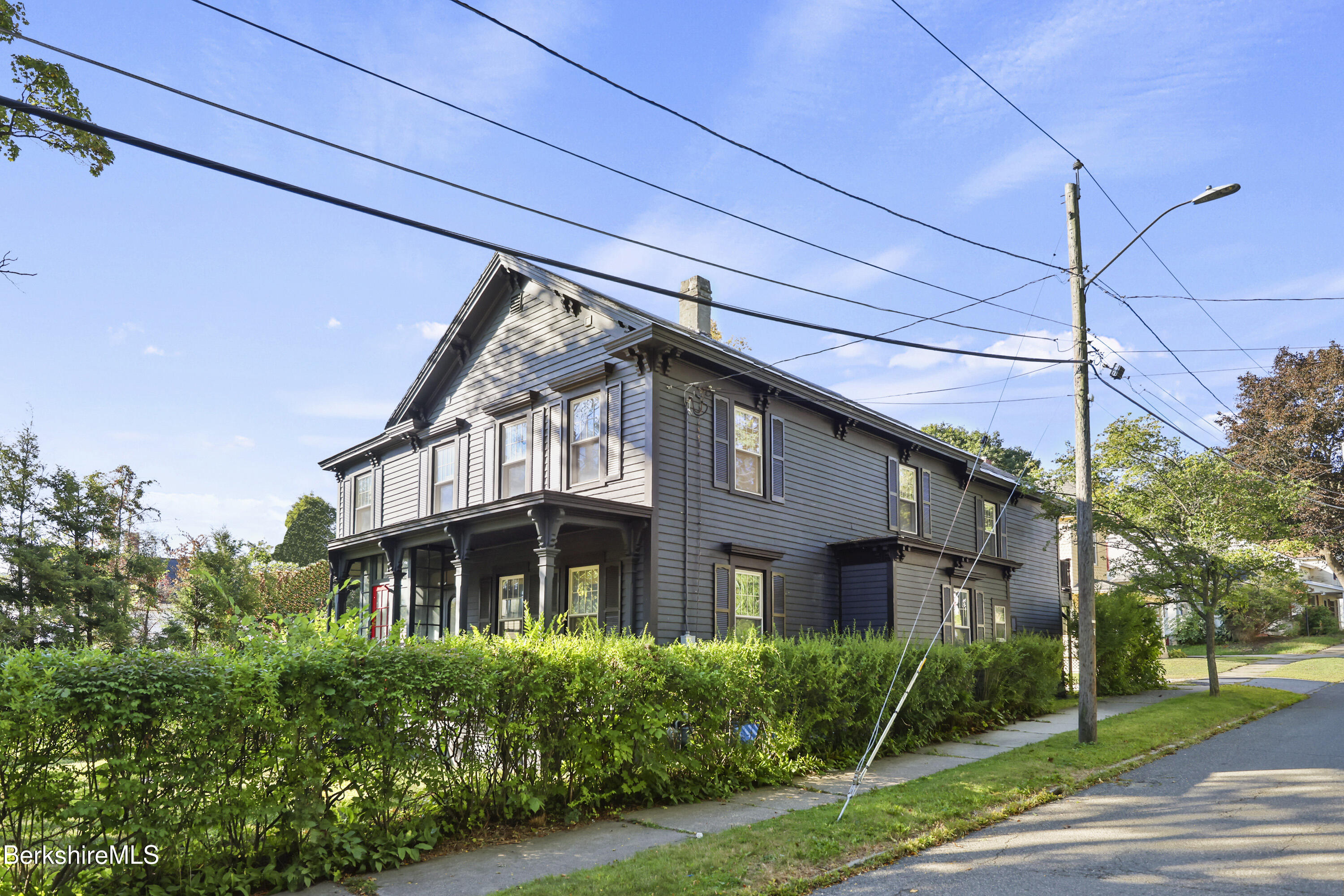 22 Maple Street Adams, MA 01220 - Photo 2 of 65 a view of a building with a yard