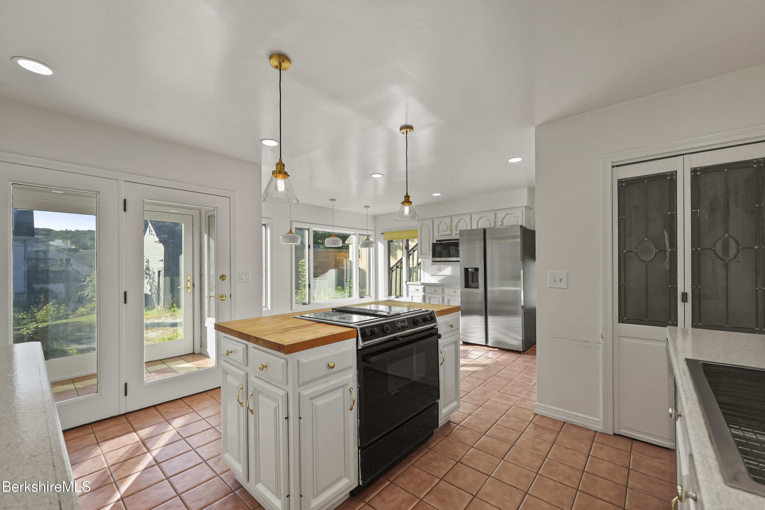 22 Maple Street Adams, MA 01220 - Photo 21 of 65 a kitchen with stainless steel appliances granite countertop a stove a sink and a refrigerator