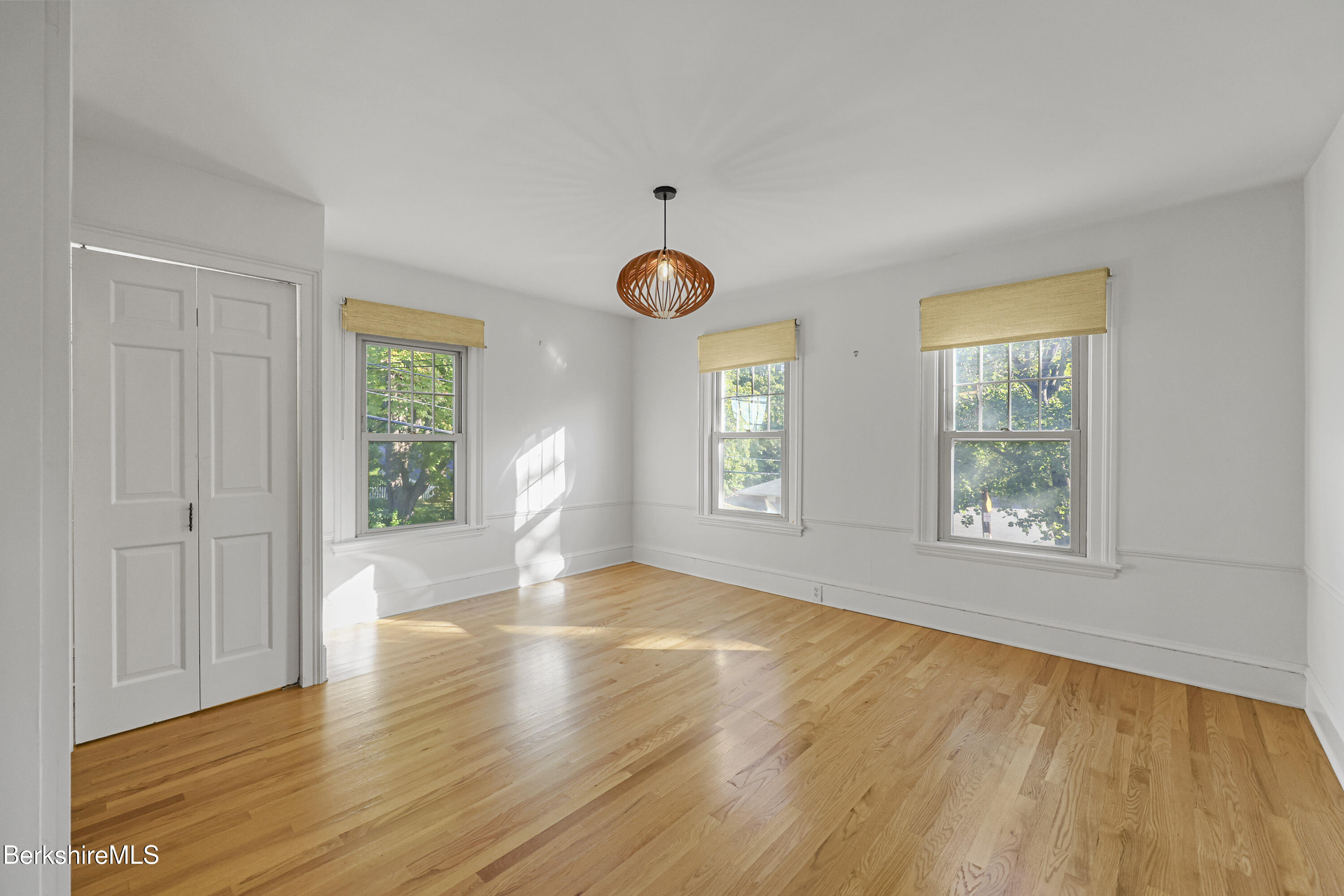 22 Maple Street Adams, MA 01220 - Photo 28 of 65 a view of an empty room with wooden floor and a window