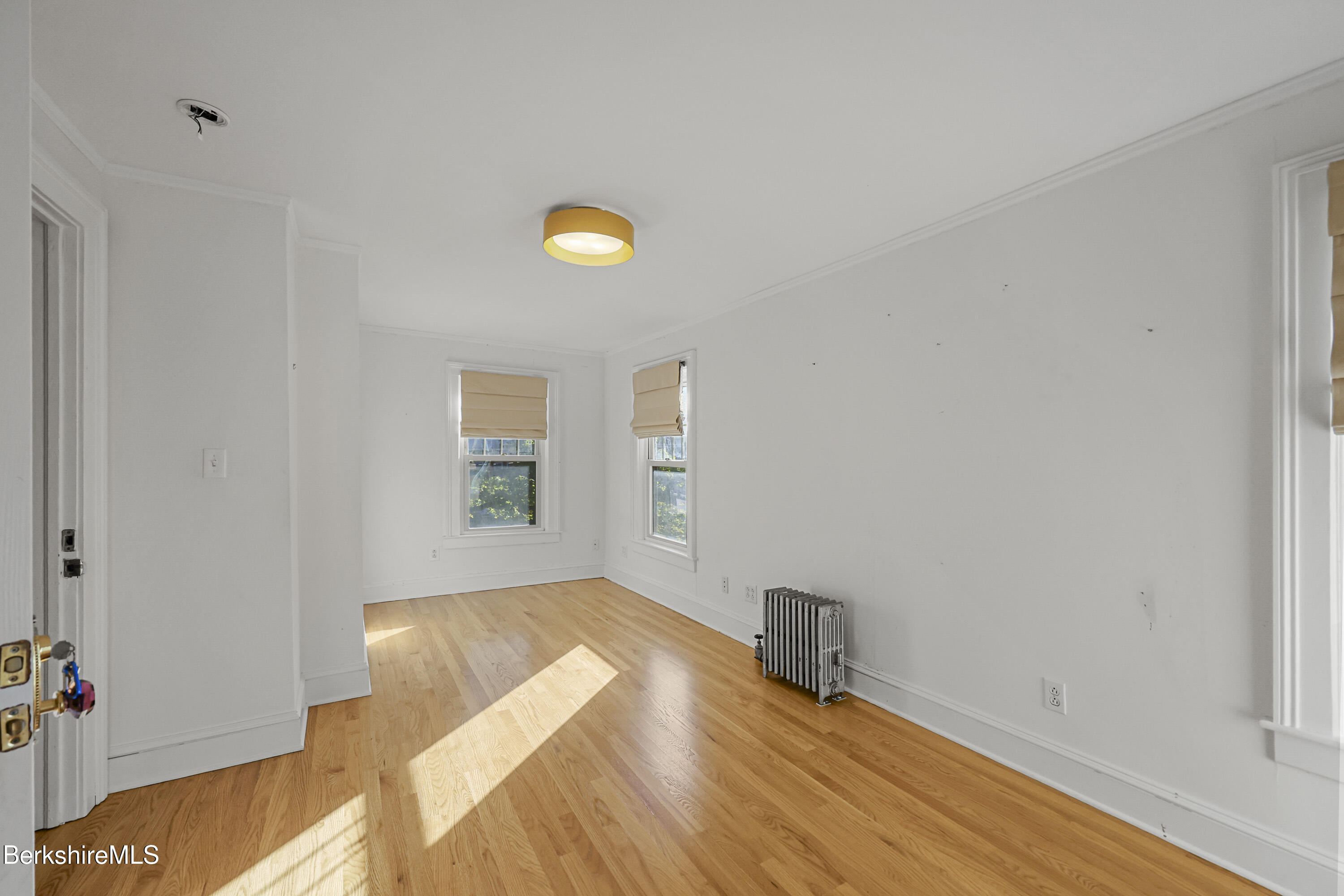 22 Maple Street Adams, MA 01220 - Photo 32 of 65 a view of a bedroom with wooden floor and bathroom