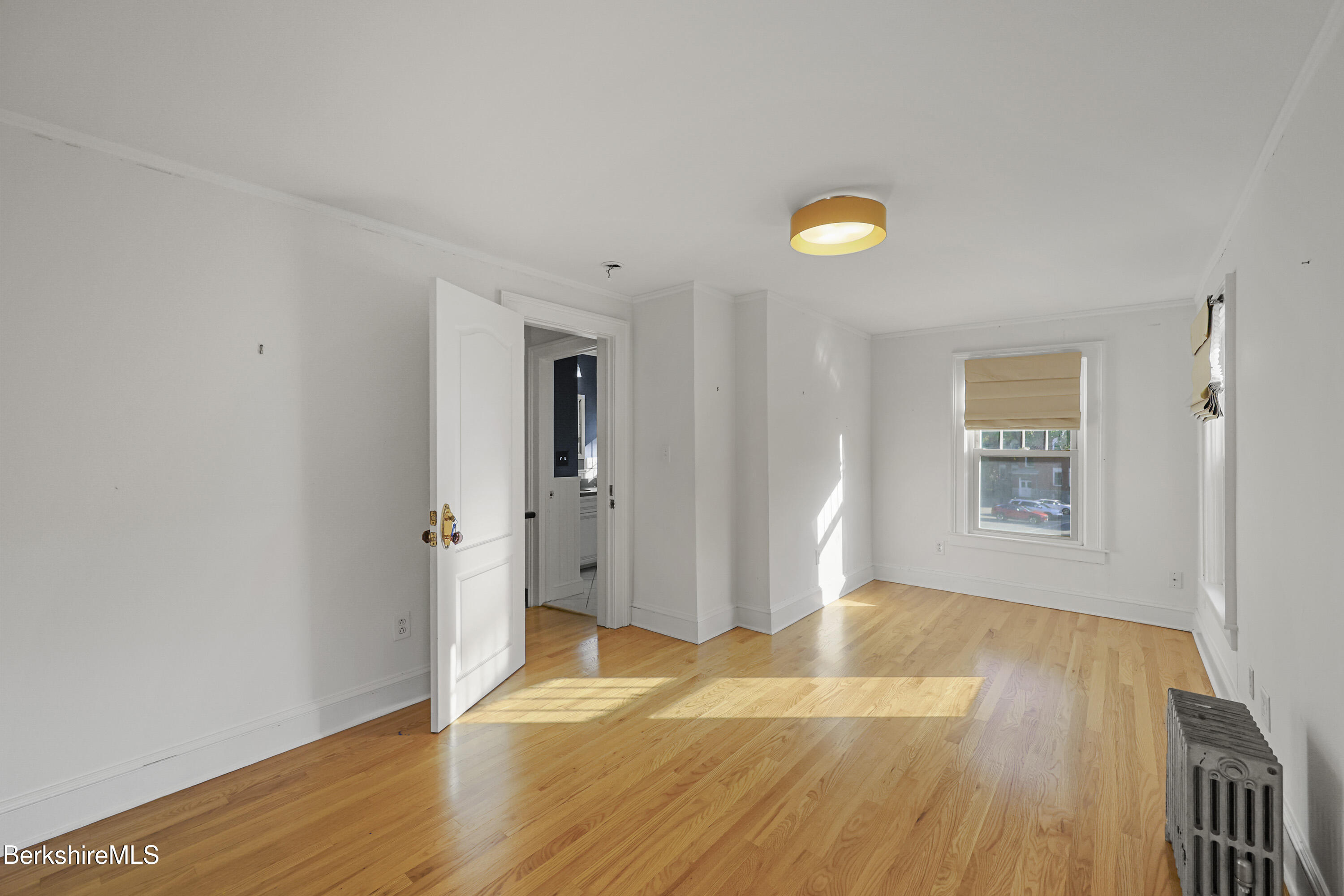 22 Maple Street Adams, MA 01220 - Photo 33 of 65 a view of a room with wooden floor and window