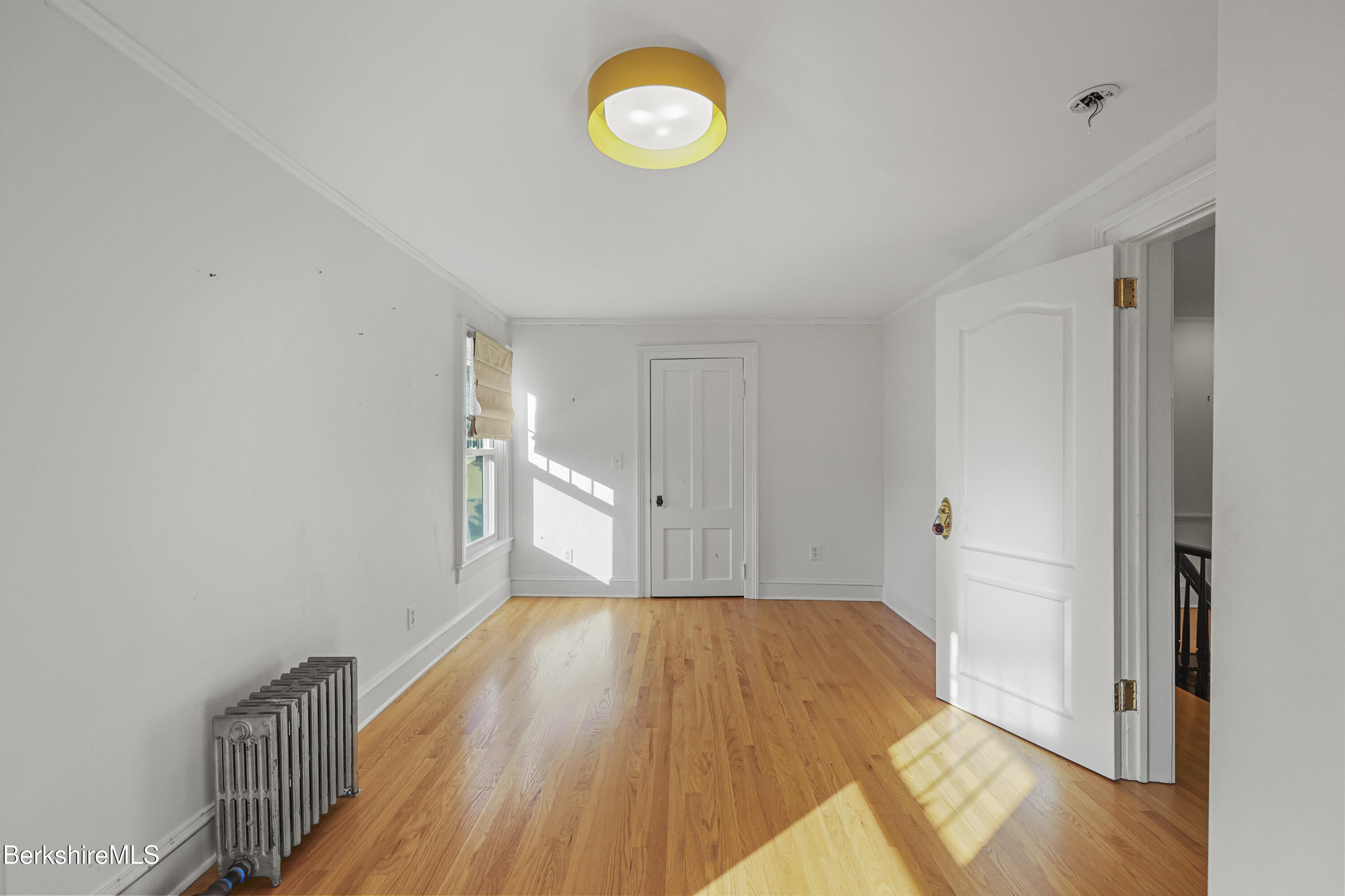 22 Maple Street Adams, MA 01220 - Photo 35 of 65 a view of a room with wooden floor and window