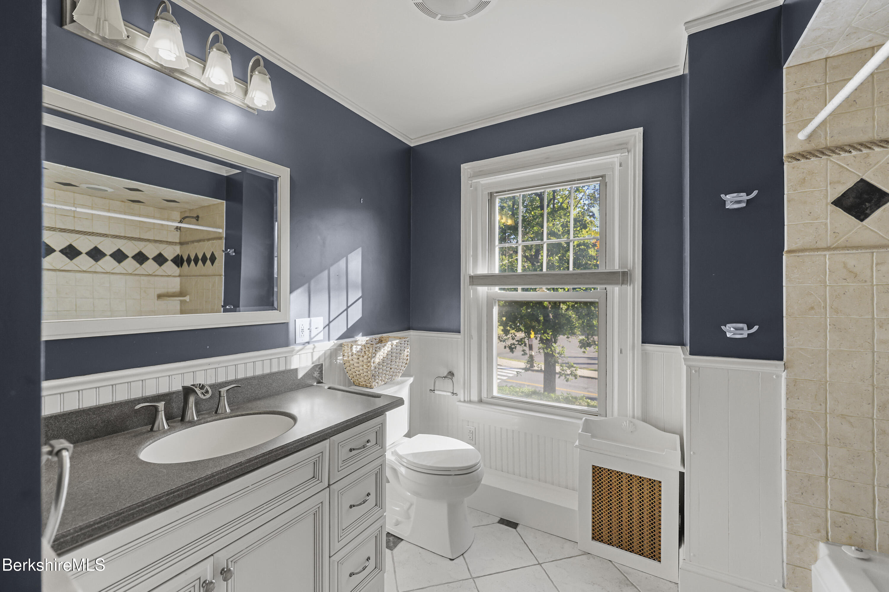 22 Maple Street Adams, MA 01220 - Photo 36 of 65 a bathroom with a granite countertop sink toilet a mirror and a window