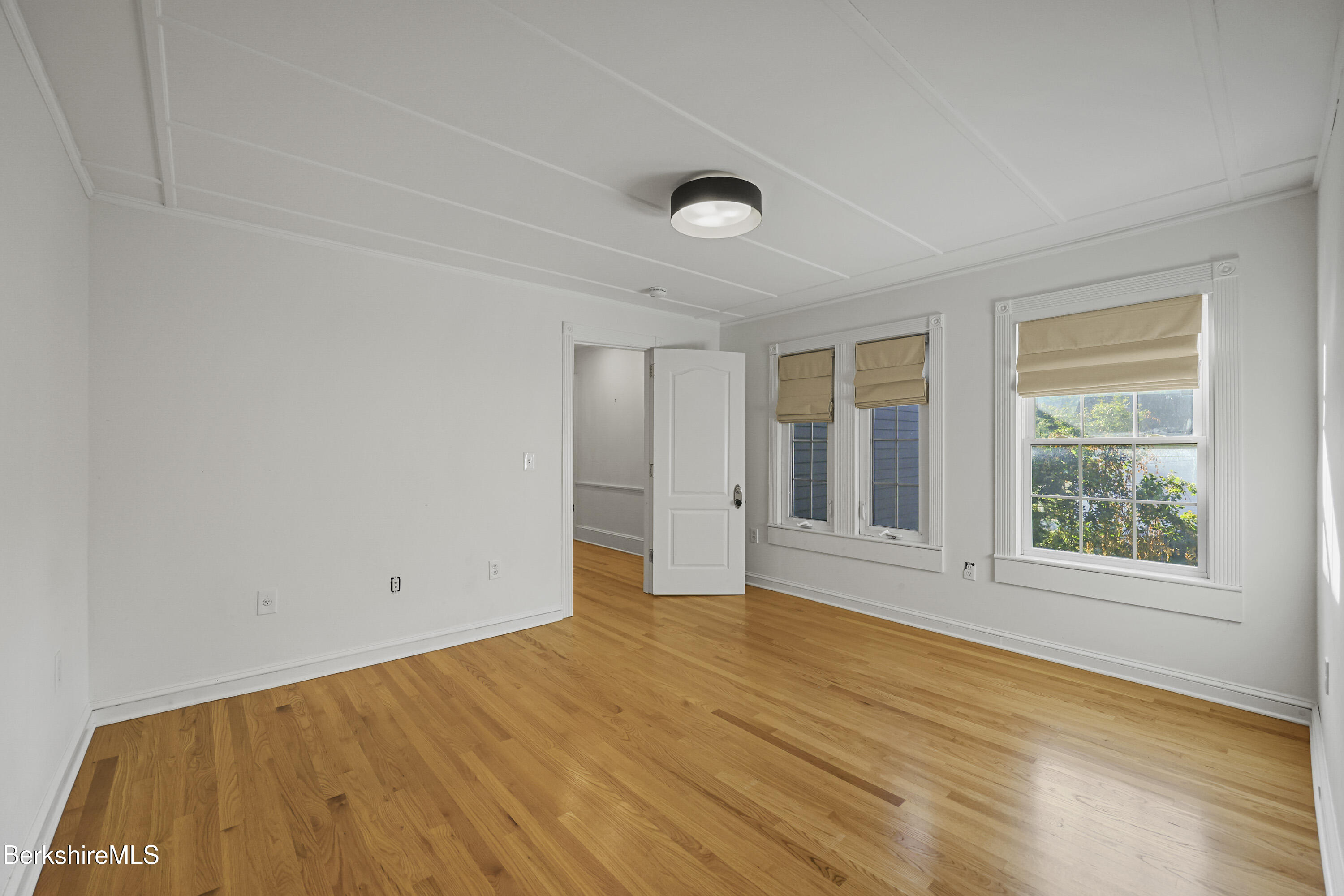 22 Maple Street Adams, MA 01220 - Photo 41 of 65 an empty room with wooden floor and windows