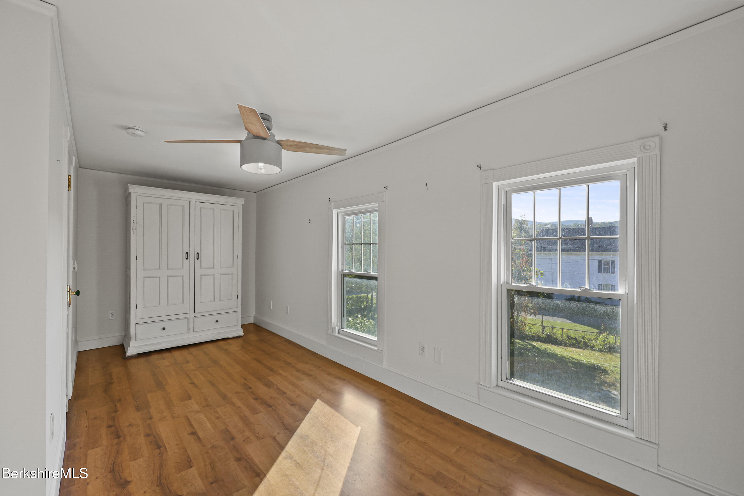 22 Maple Street Adams, MA 01220 - Photo 48 of 65 a view of an empty room with wooden floor and a window