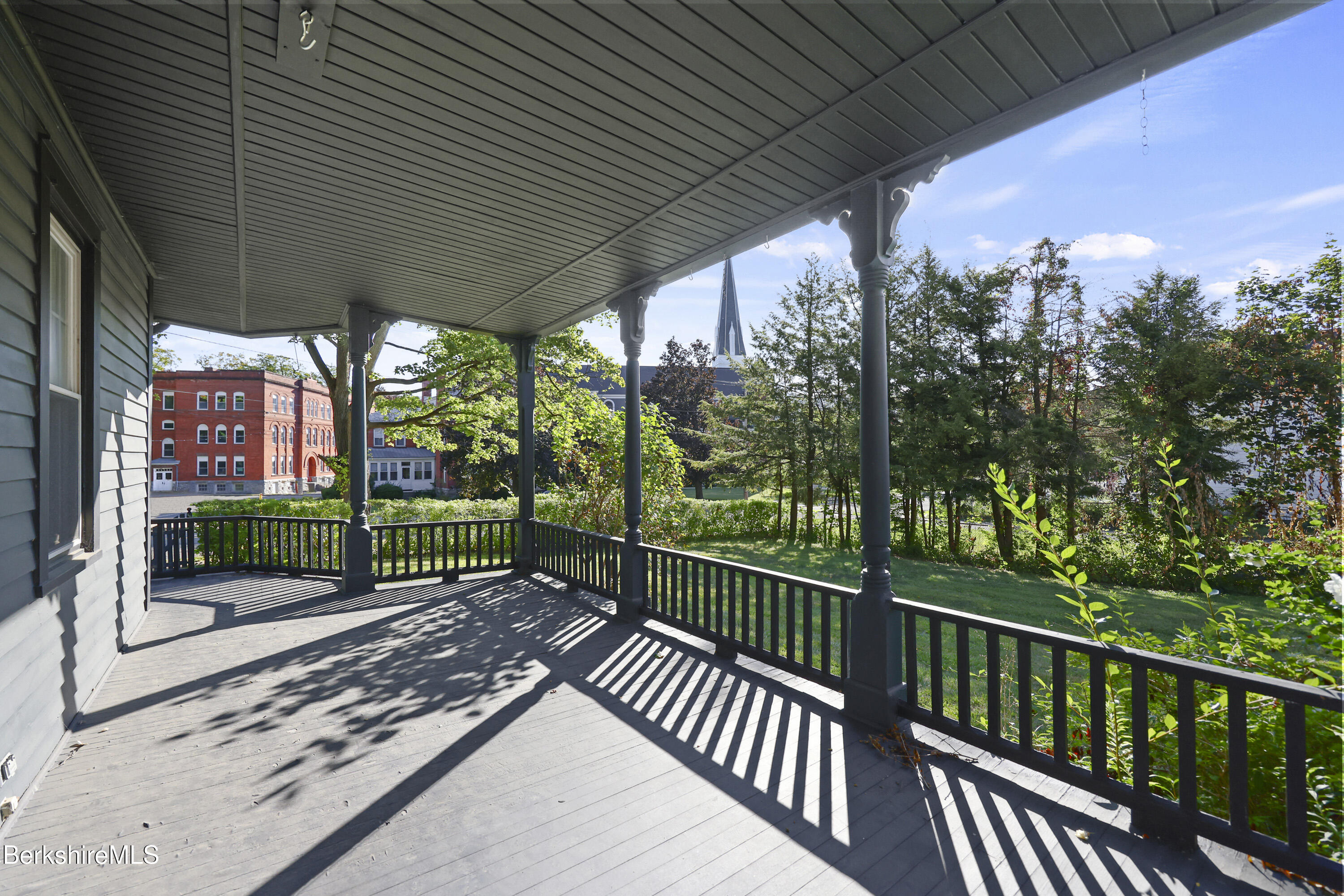 22 Maple Street Adams, MA 01220 - Photo 57 of 65 a view of a porch with wooden floor and floor to ceiling window