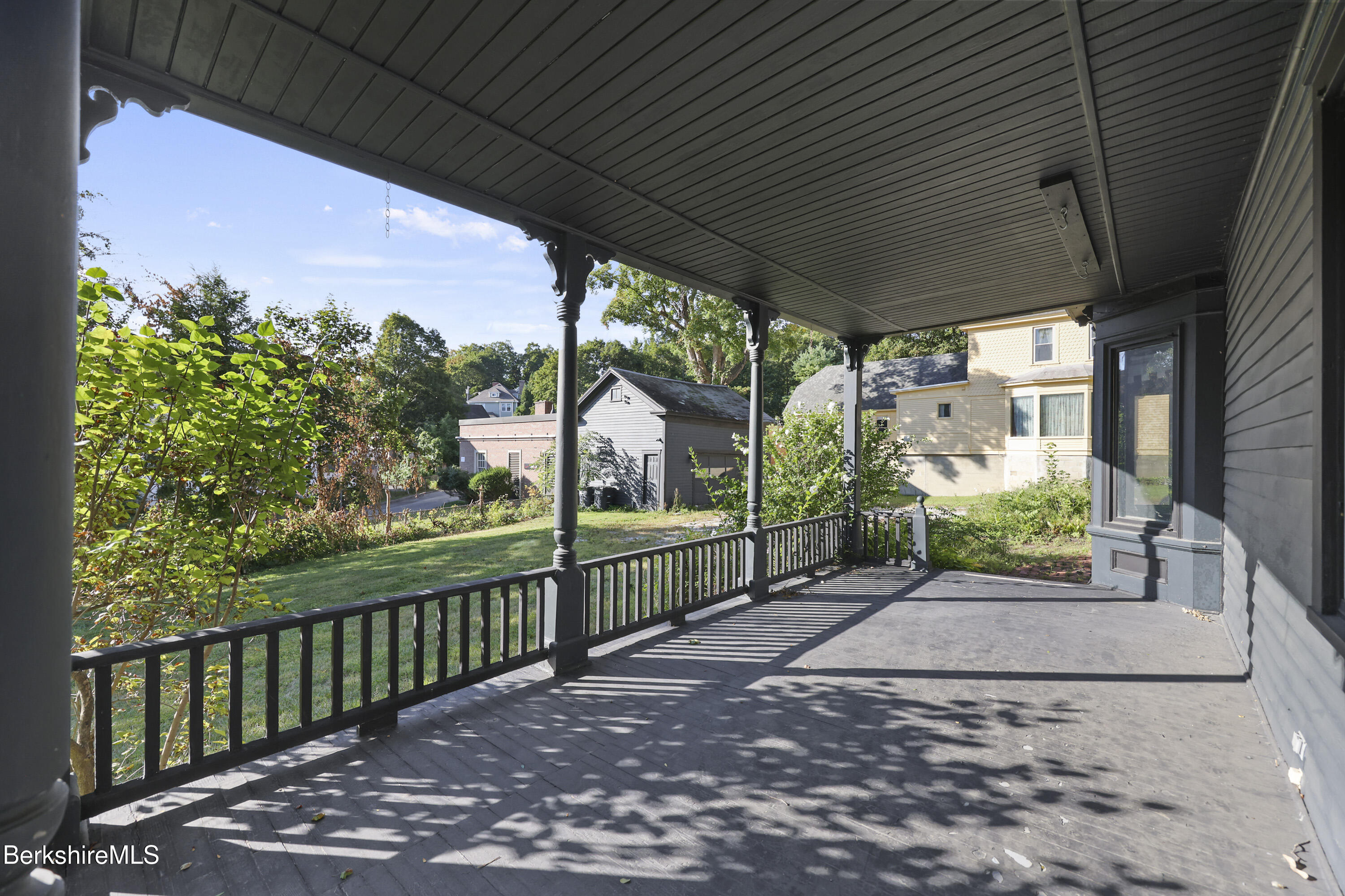 22 Maple Street Adams, MA 01220 - Photo 59 of 65 a view of a porch with wooden floor in front of a house