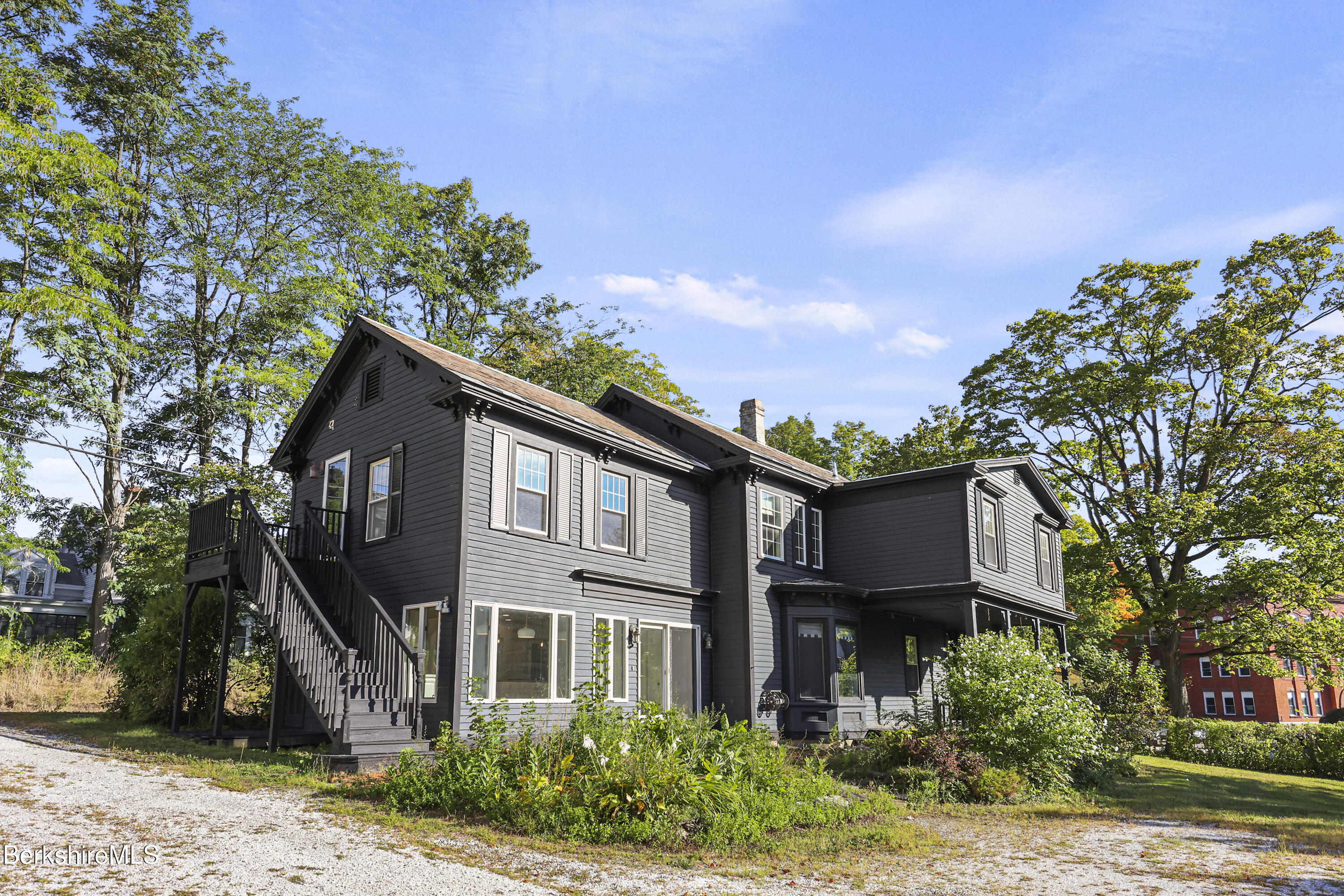 22 Maple Street Adams, MA 01220 - Photo 60 of 65 a front view of a house with a garden