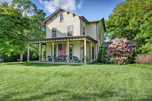 996 Old Post Road Fairfield, CT 06824 - Photo 1 of 1 a front view of a house with garden