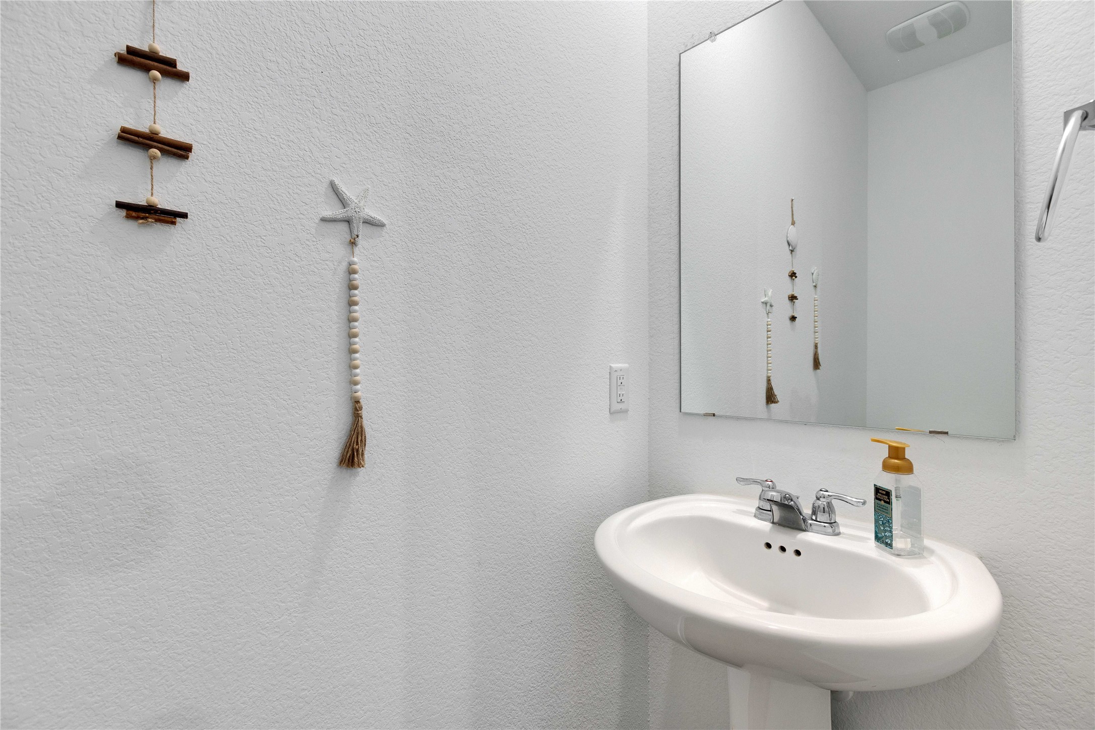 206 Canley Loop Hutto, TX 78634 - Photo 10 of 31 a bathroom with a sink a mirror and shower