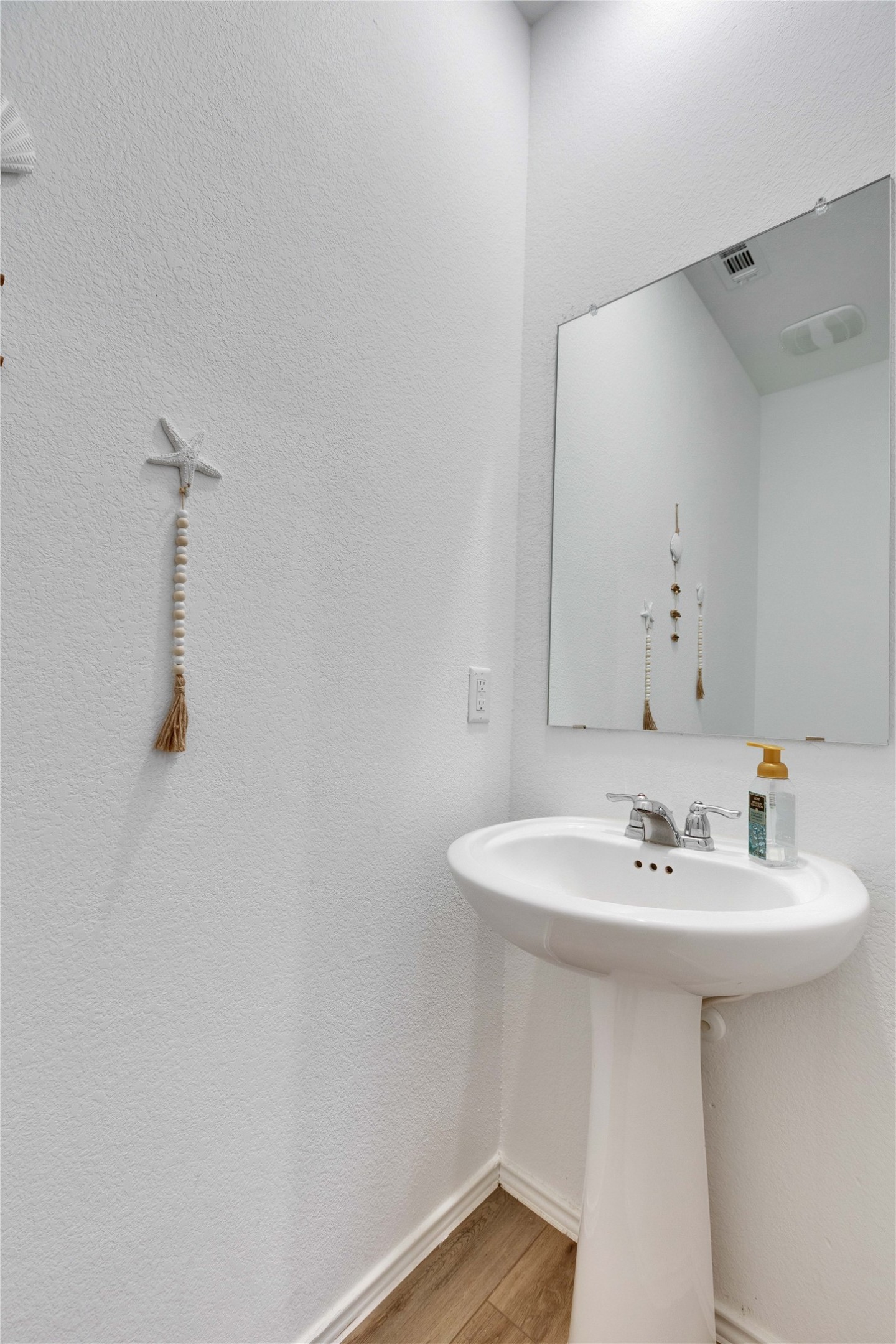 206 Canley Loop Hutto, TX 78634 - Photo 11 of 31 a bathroom with a sink and a mirror