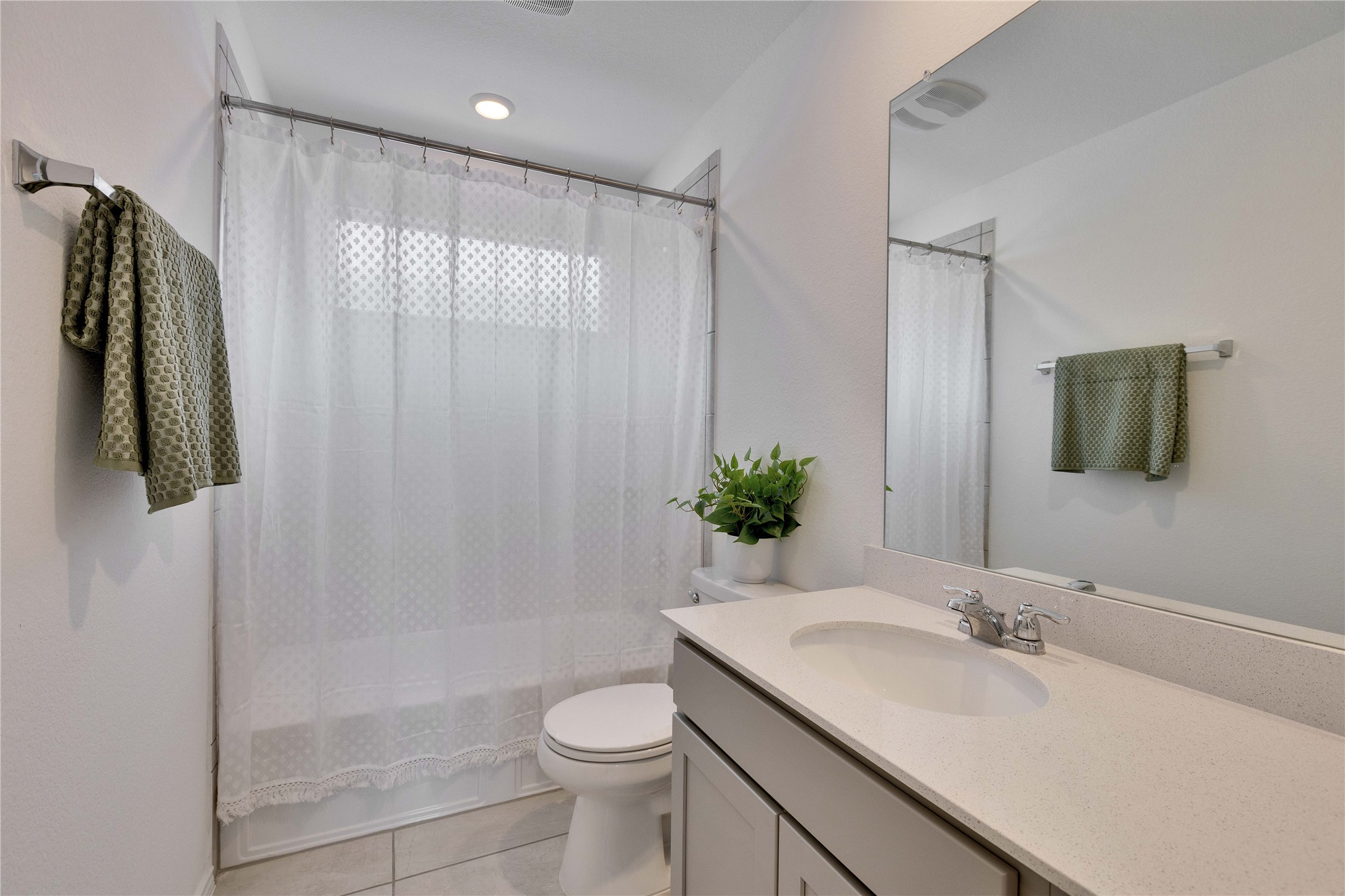 206 Canley Loop Hutto, TX 78634 - Photo 21 of 31 a bathroom with a granite countertop sink and a mirror