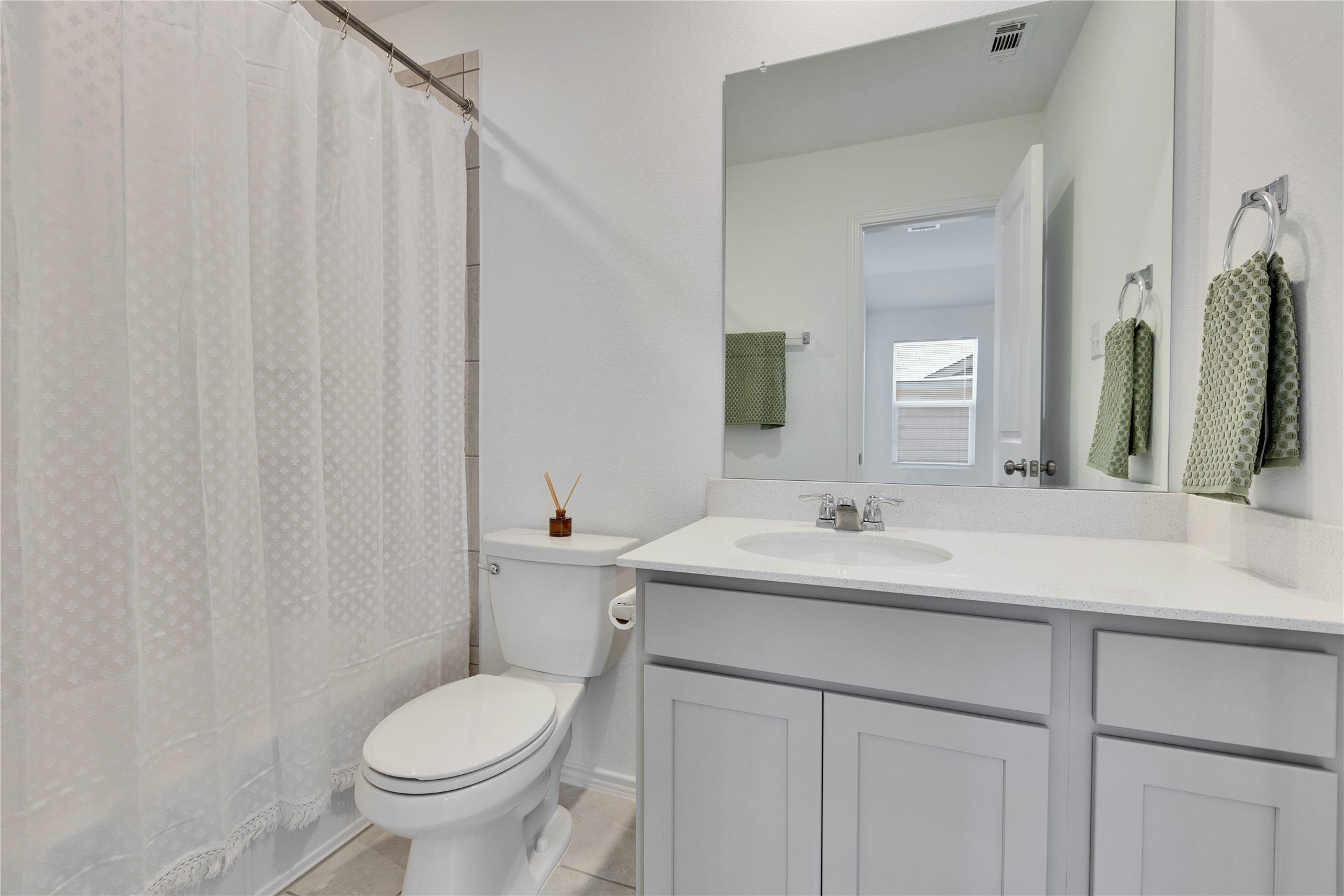 206 Canley Loop Hutto, TX 78634 - Photo 25 of 31 a bathroom with a sink toilet and mirror