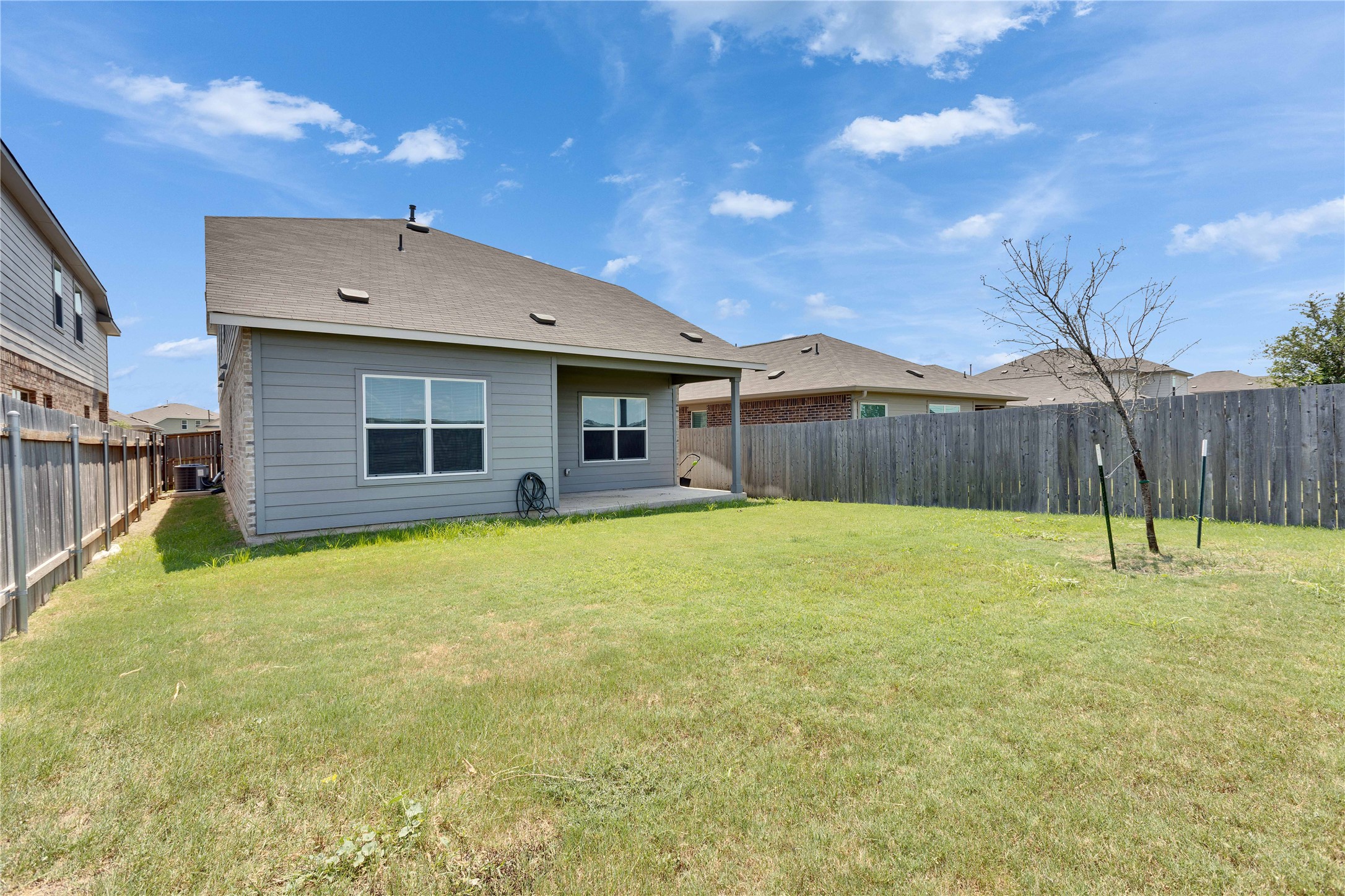 206 Canley Loop Hutto, TX 78634 - Photo 30 of 31 a swimming pool with wooden fence