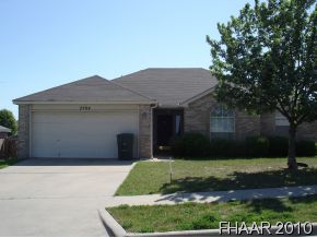 2704 Rampart Loop Killeen, TX 76542 - Photo 1 of 1 a front view of a house with a yard