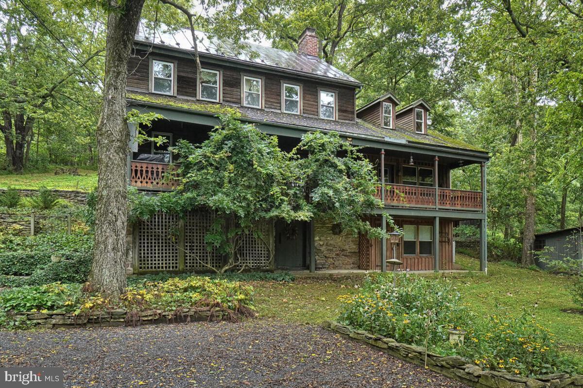 7151 Picnic Woods Road Middletown, MD 21769 - Photo 1 of 72 a front view of a house with garden