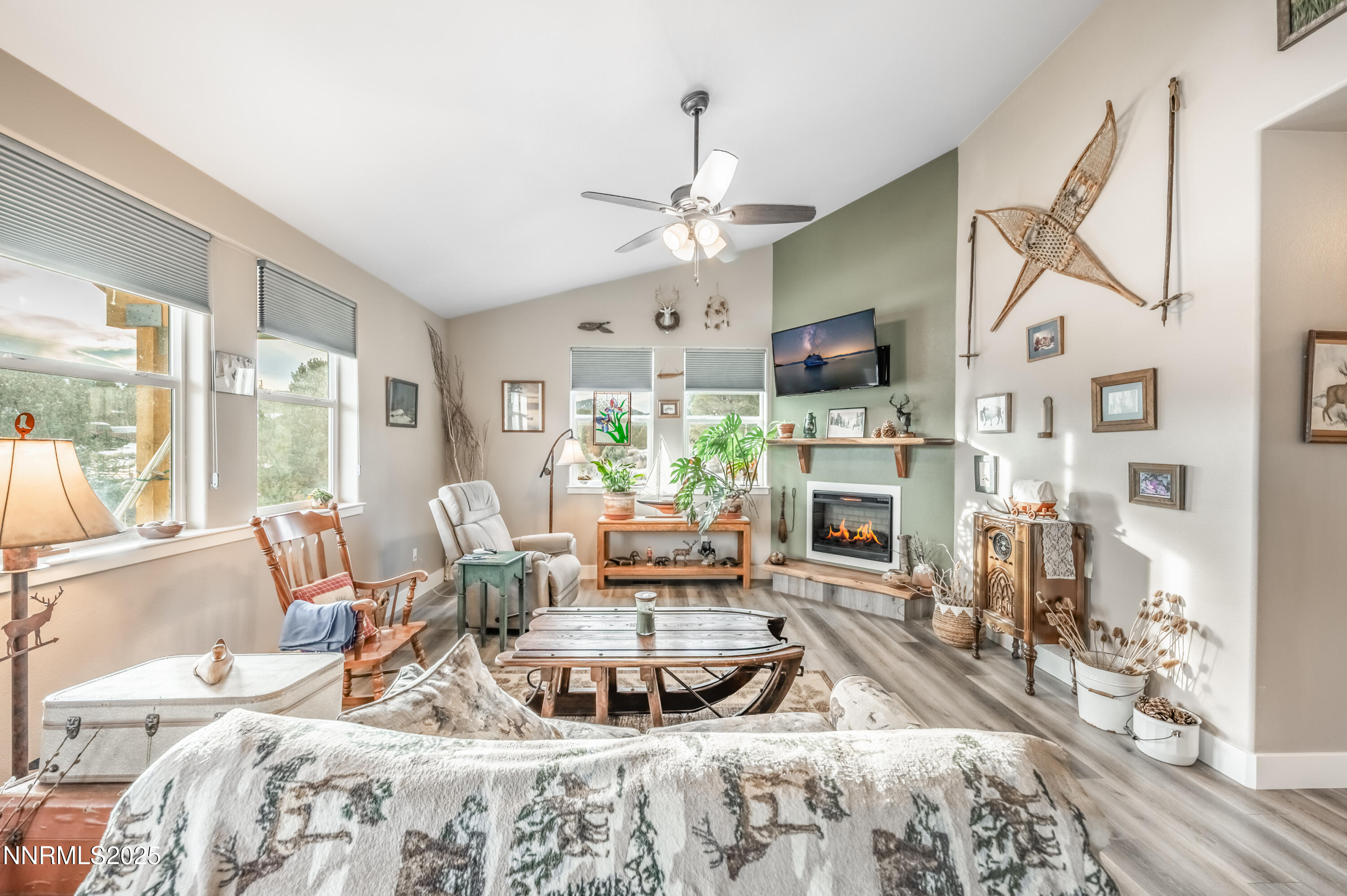 2486 Cartwright Road Reno, NV 89521 - Photo 11 of 44 a living room with furniture a fireplace and a flat screen tv