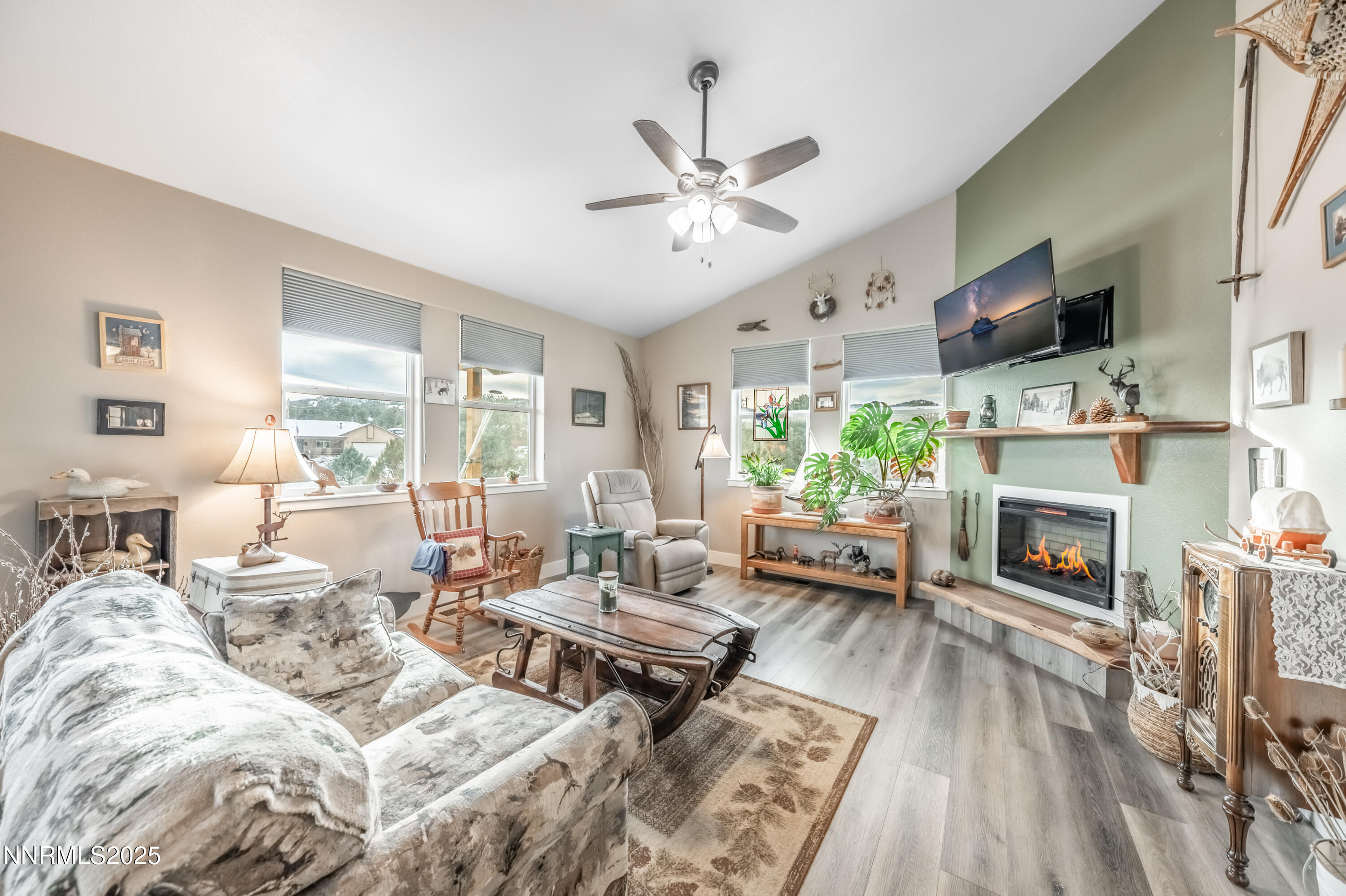 2486 Cartwright Road Reno, NV 89521 - Photo 12 of 44 a living room with furniture fireplace and flat screen tv