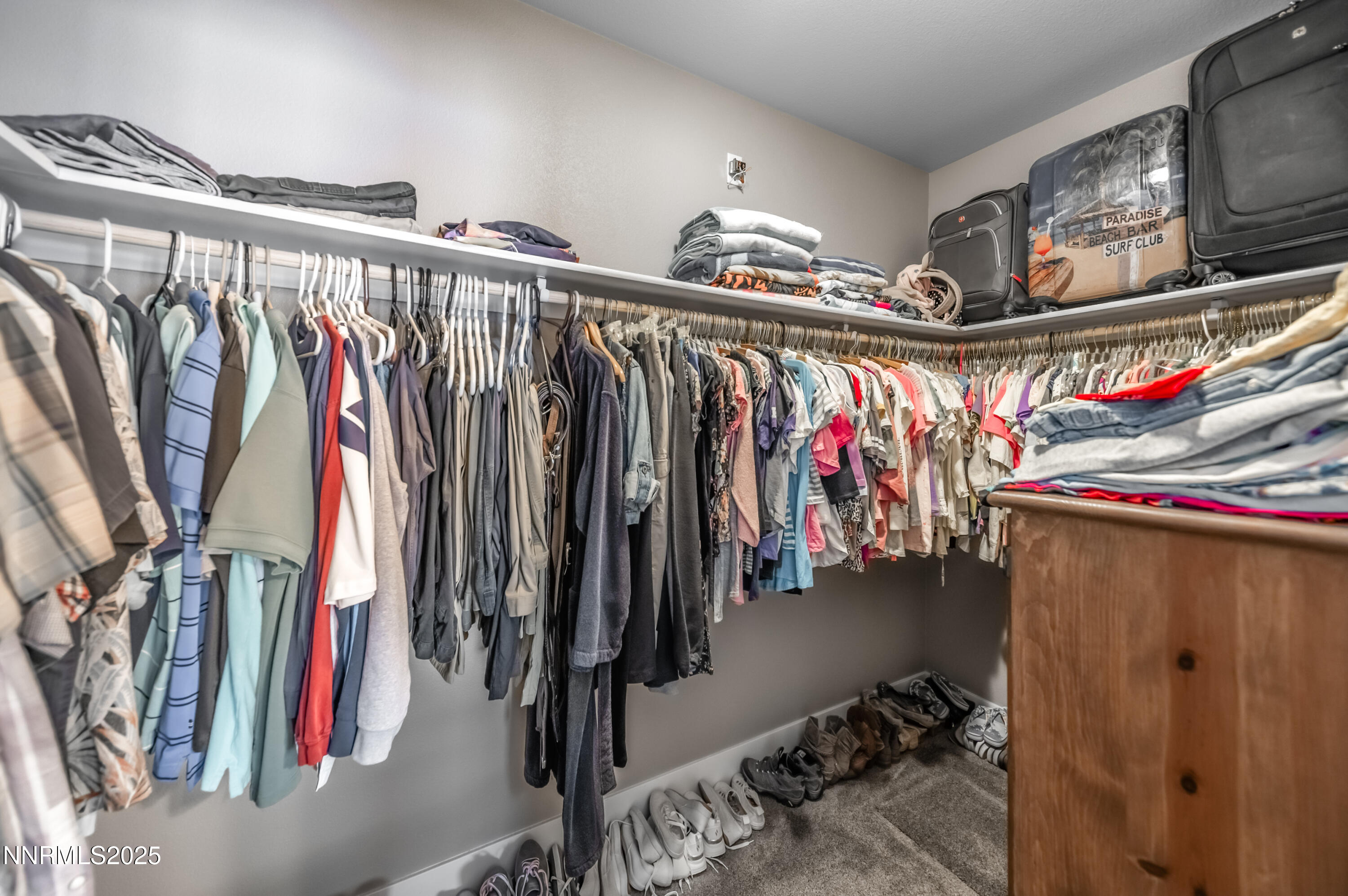 2486 Cartwright Road Reno, NV 89521 - Photo 19 of 44 a view of walk in closet with clothes and shoes