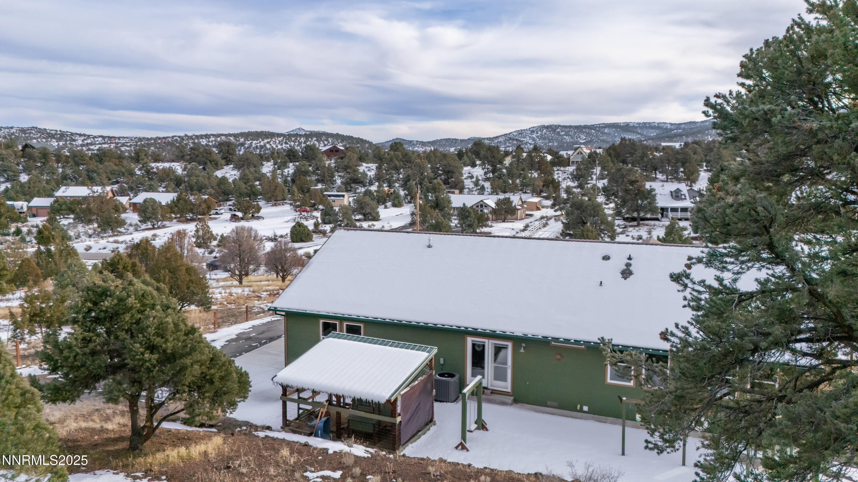 2486 Cartwright Road Reno, NV 89521 - Photo 32 of 44 an aerial view of a house with a garden and mountain view