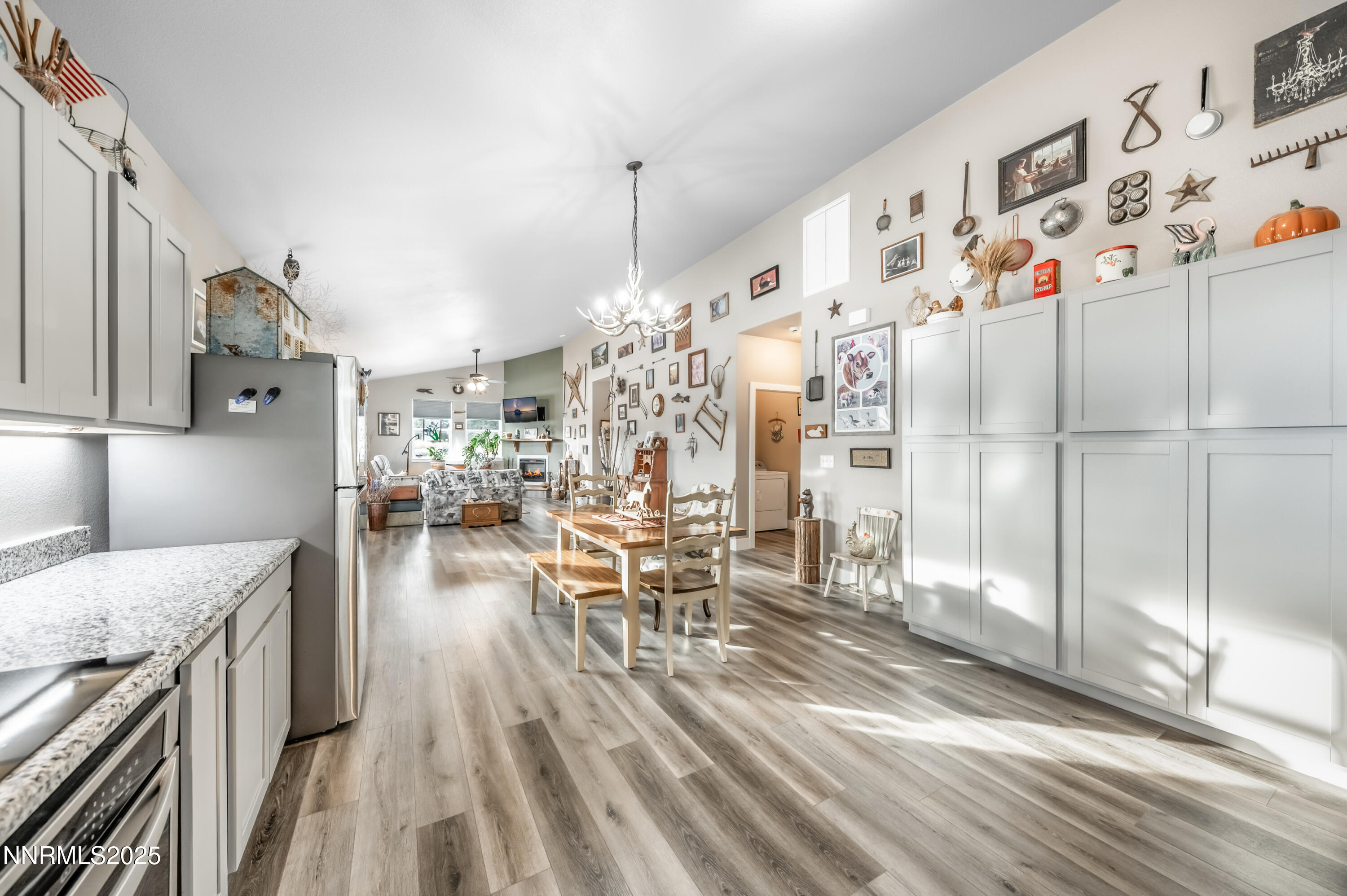 2486 Cartwright Road Reno, NV 89521 - Photo 7 of 44 a living room with stainless steel appliances kitchen island granite countertop furniture and a kitchen view