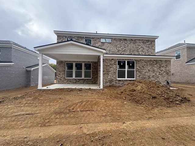 a dining room with kitchen island a table and chairs