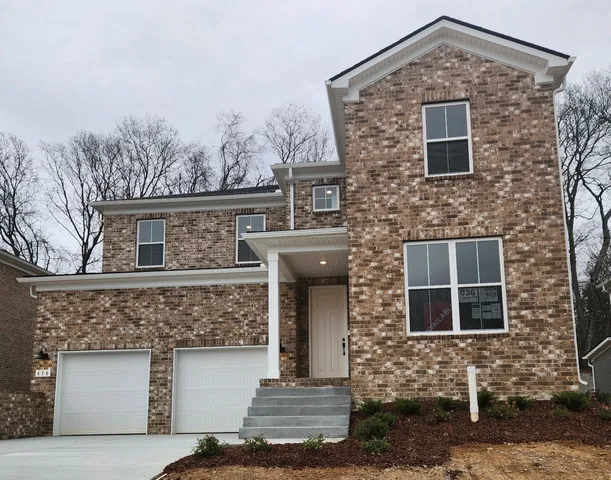 a kitchen with a table and chairs in it