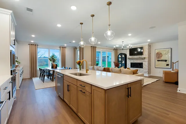 a living room with furniture and a ceiling fan
