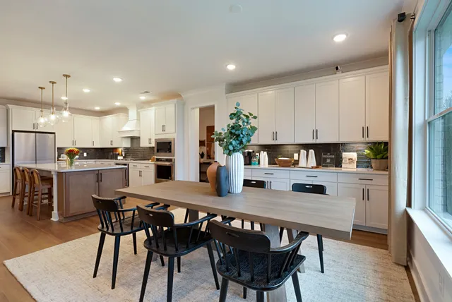 a view of a hallway with paintings on the wall