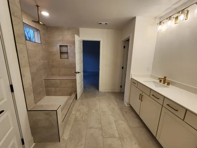 a view of a hallway view with wooden floor and staircase