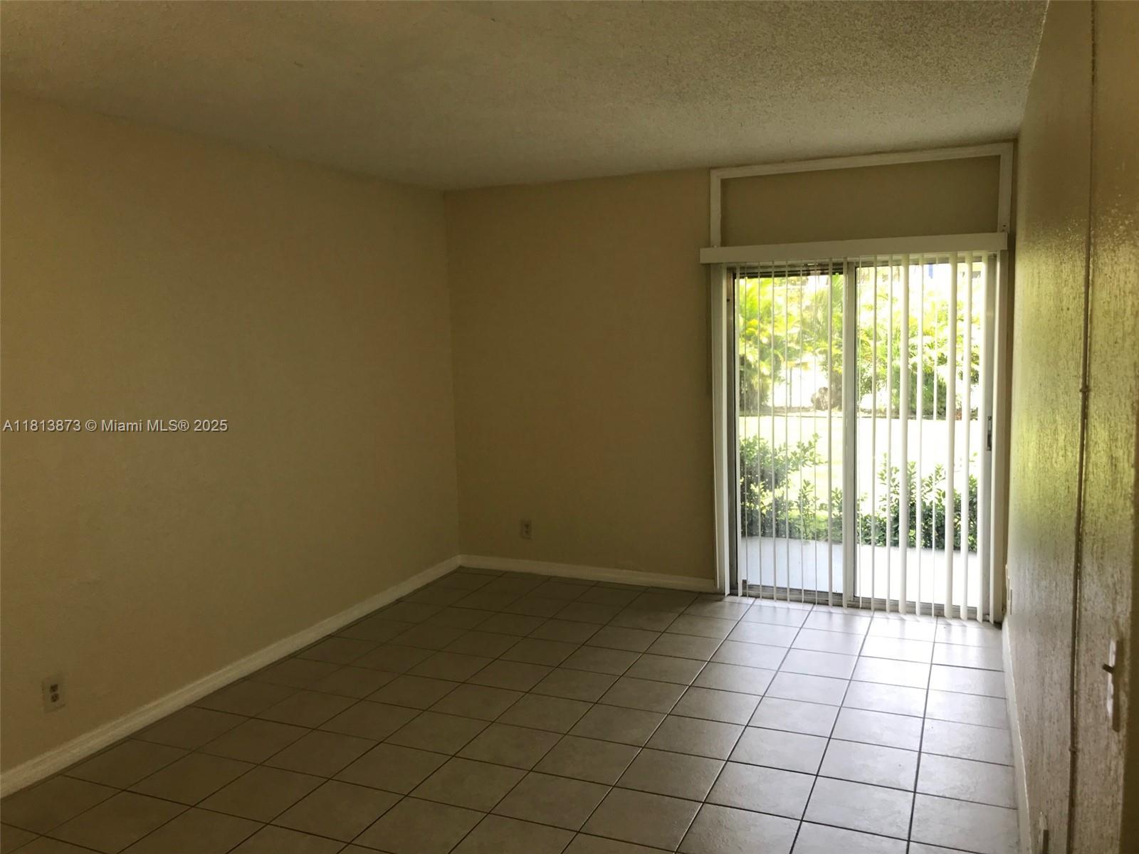 a view of an empty room and window