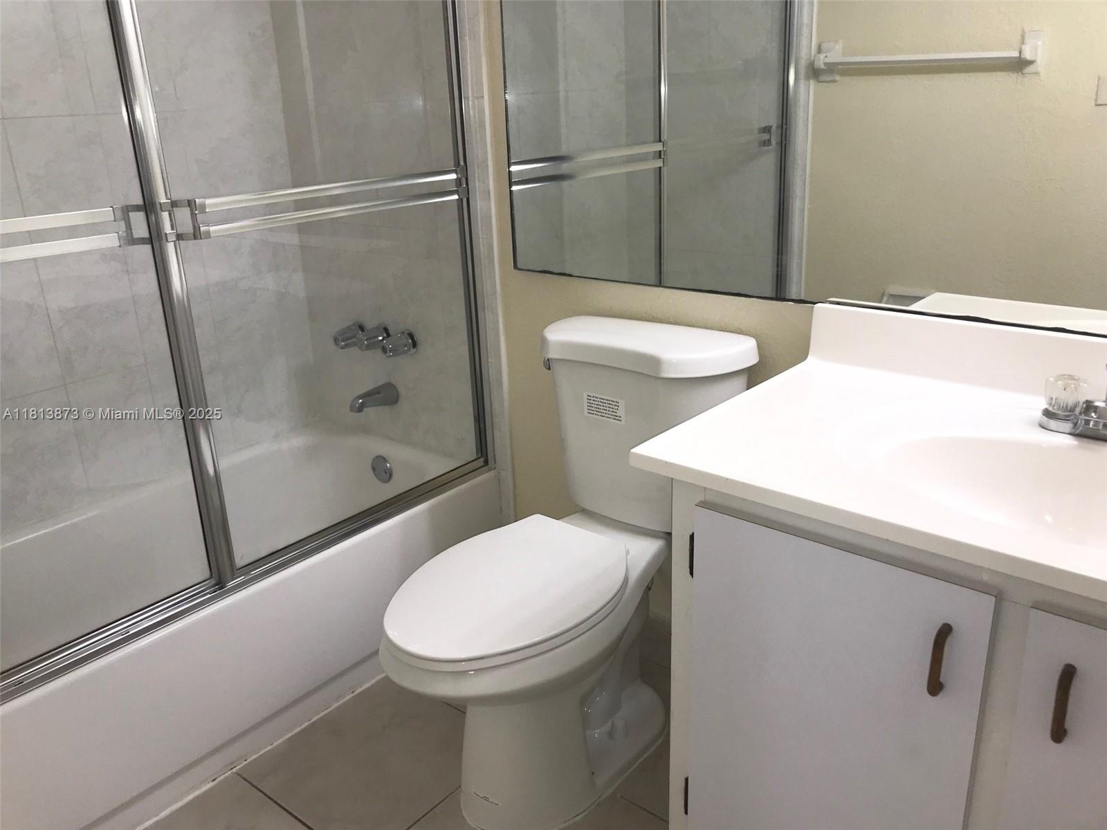 Flagami Miami, FL 33126 - Photo 3 of 9 a white toilet sitting next to a bath tub