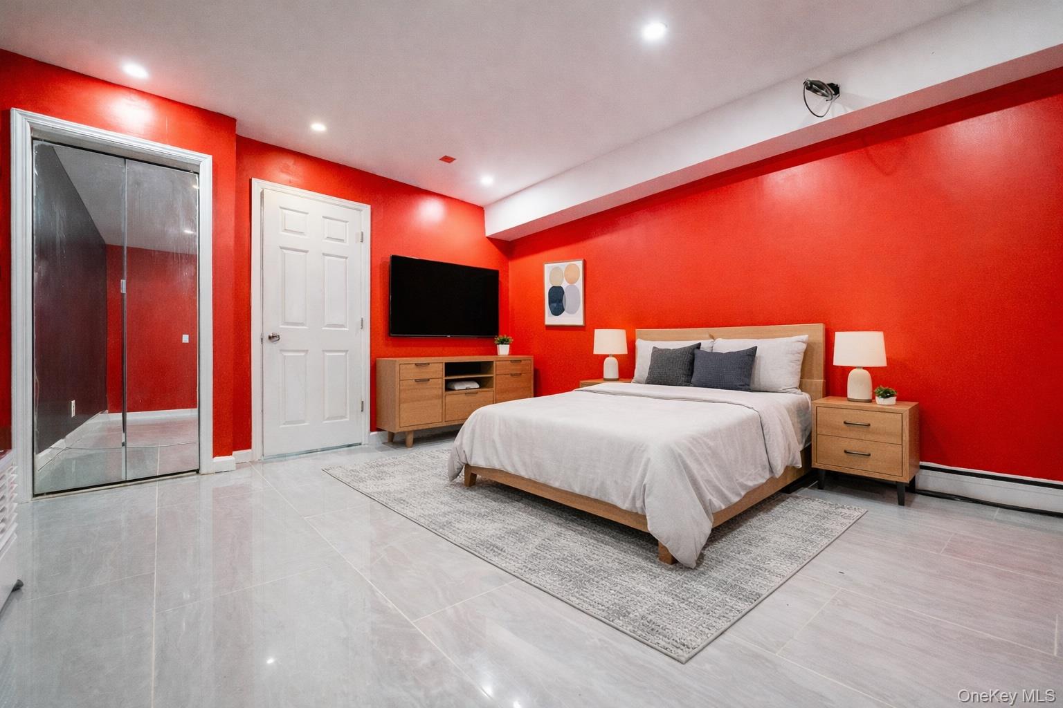 23 Yucca Drive Staten Island, NY 10312 - Photo 11 of 21 Bedroom featuring a baseboard heating unit and recessed lighting