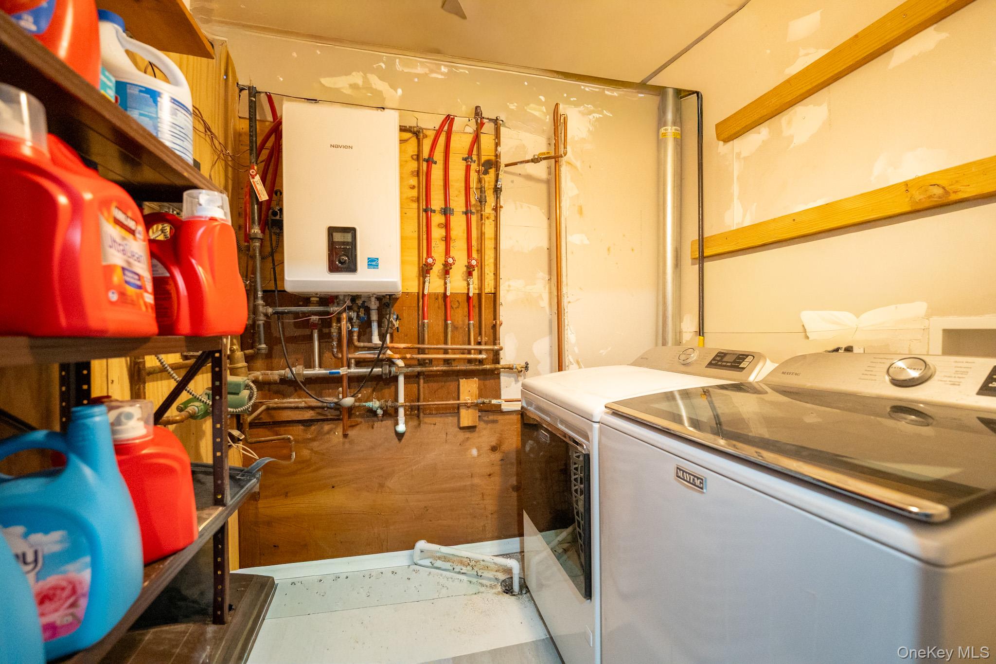 23 Yucca Drive Staten Island, NY 10312 - Photo 20 of 21 Laundry area with tankless water heater and independent washer and dryer