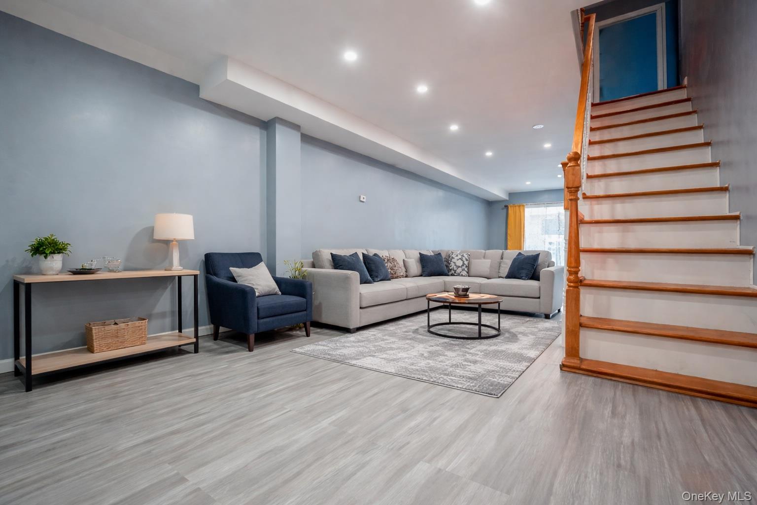 23 Yucca Drive Staten Island, NY 10312 - Photo 3 of 21 Living room featuring recessed lighting, stairs, and light wood-type flooring