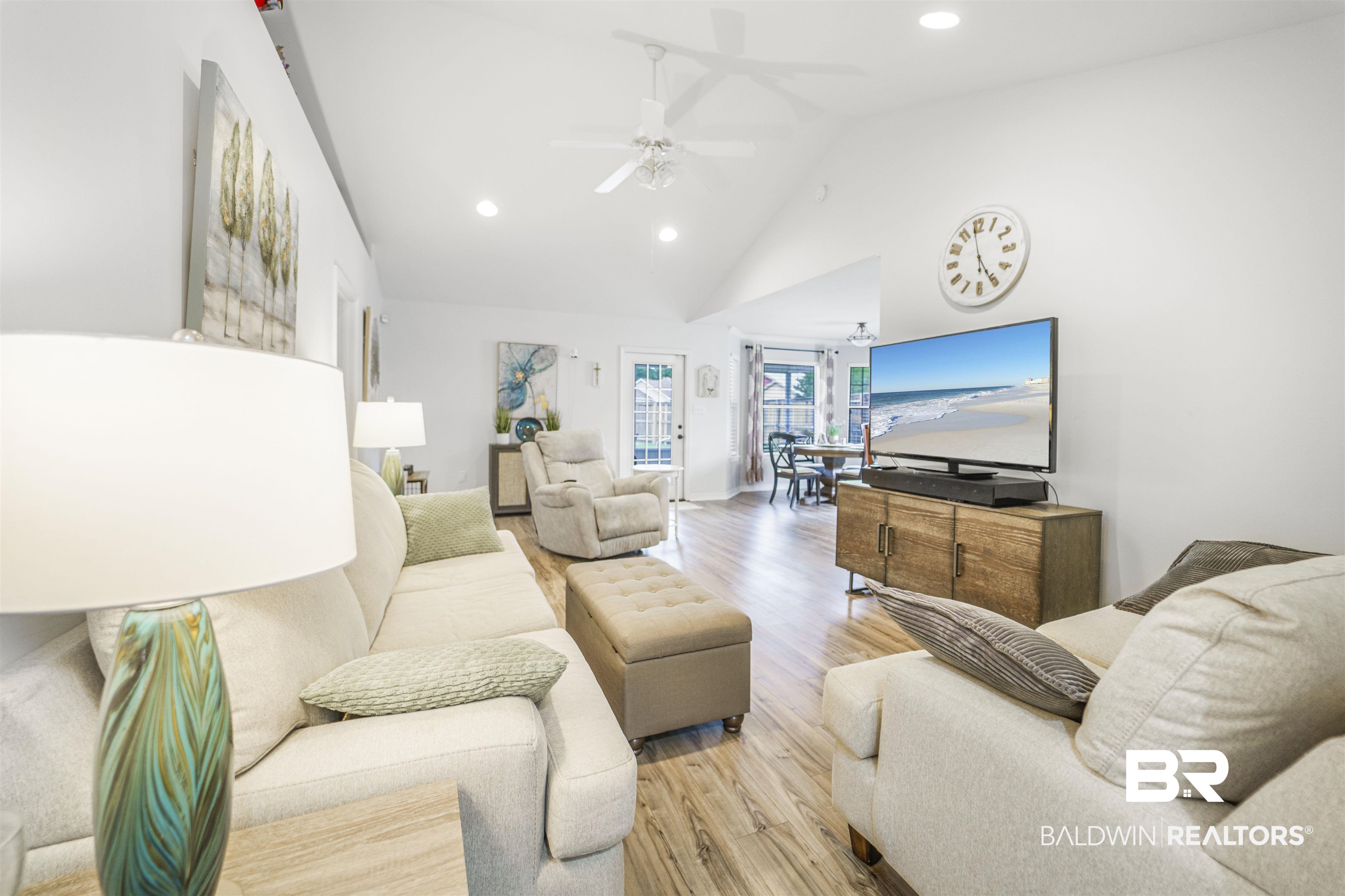 4620 Pine Boulevard Orange Beach, AL 36561 - Photo 6 of 49 Living area with recessed lighting, a ceiling fan, wood finished floors, and high vaulted ceiling