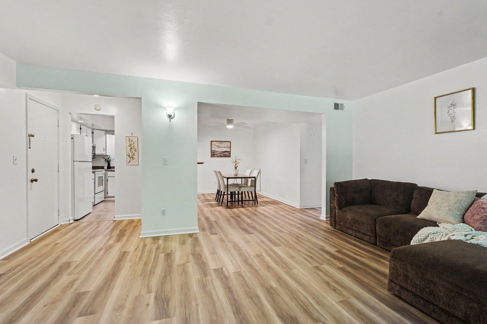 6712 Cascade Road Southeast, Unit 15 Grand Rapids, MI 49546 - Photo 6 of 17 Living room into dining and kitchen