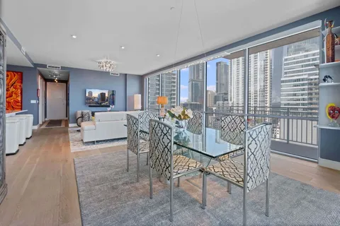 a view of a dining room with furniture window and outside view