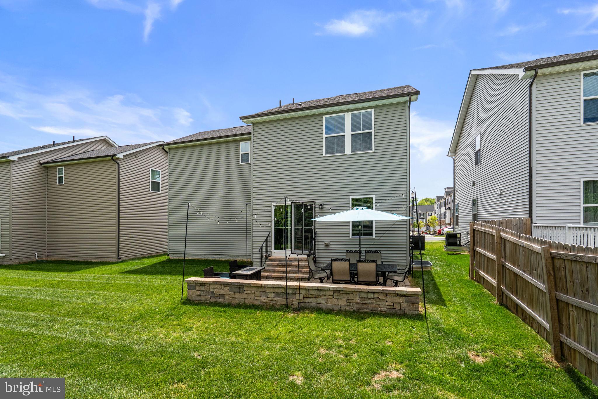1713 Aurora Way Frederick, MD 21702 - Photo 56 of 57 a view of a backyard with a sitting area and a small yard