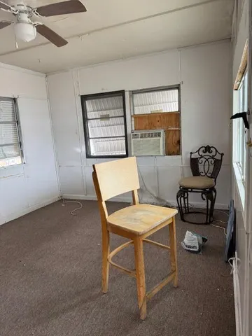 a bedroom with furniture and a window