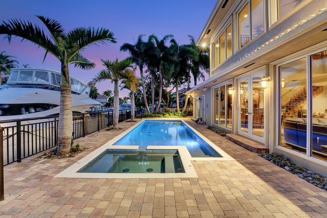 a living room with furniture fireplace and a flat screen tv