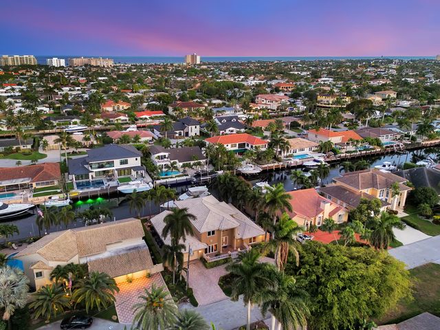 a view of a patio with table and chairs and potted plants