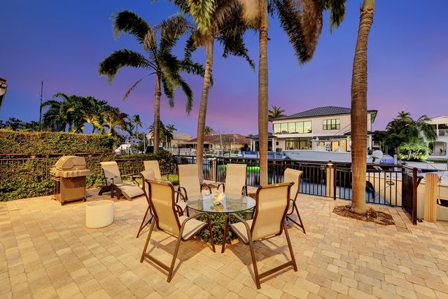 a view of a swimming pool with a lounge chair